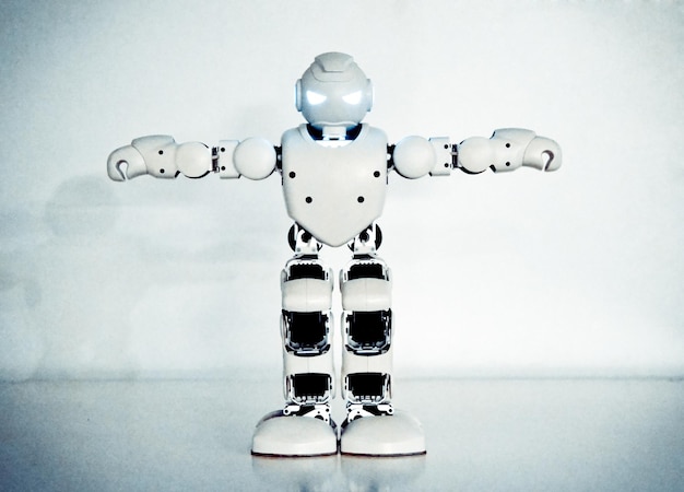 Small cyborg robots humanoids with face and body dances to music