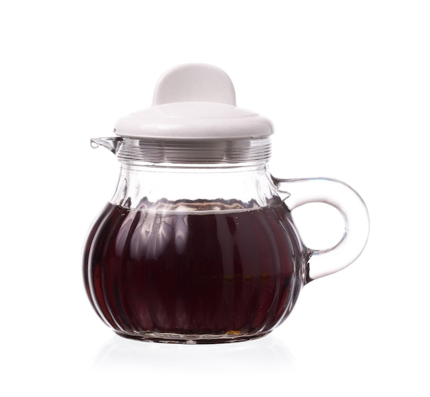 Small decanter with Soy sauce isolated on the white background