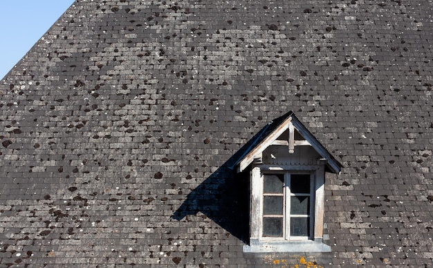 Small Dormer Window in stone roof of Navarrenx