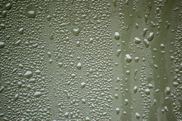 small drops of water on a misted glass