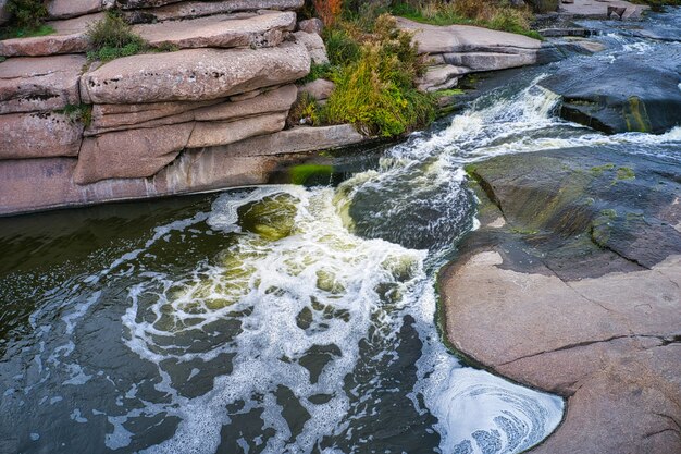 Small fast waterfall Kamenka in the evening light in Ukraine