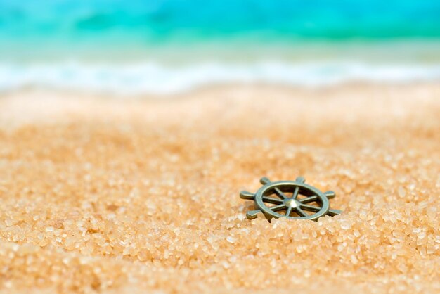 Premium Photo  Silver ring with spiral pattern in the sand on the  background of beach and sea