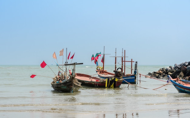 Small fishing boats on beach in Thailand