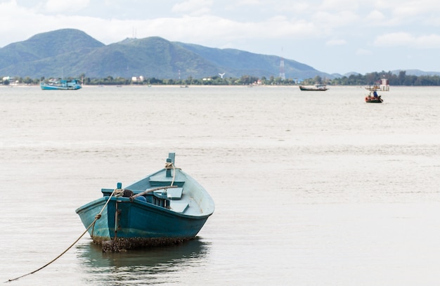 Small fishing boats made from wood on the beach, Fishing boats in the sea in Thailand