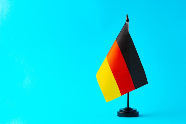 Small flag of germany on flagpole close up