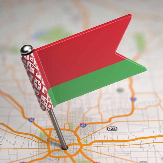 Small Flag of Republic of Belarus on a Map Background with Selective Focus.