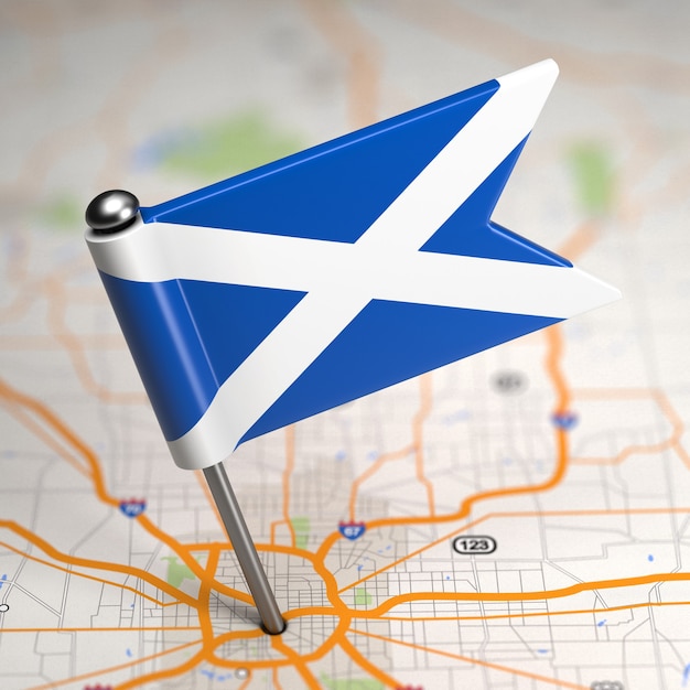 Small flag of scotland on a map background with selective focus