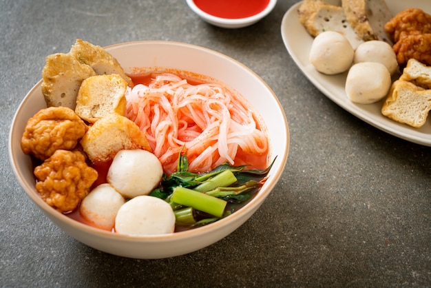 small flat rice noodles with fish balls and shrimp balls in pink soup, Yen Ta Four or Yen Ta Fo - Asian food style