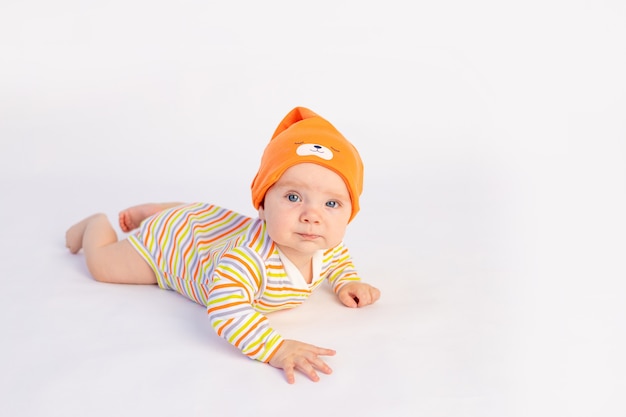 Small funny baby girl on the bed