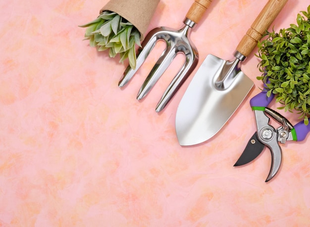 Small garden fork shovel and secateurs Top view of agricultural work Copy space for text