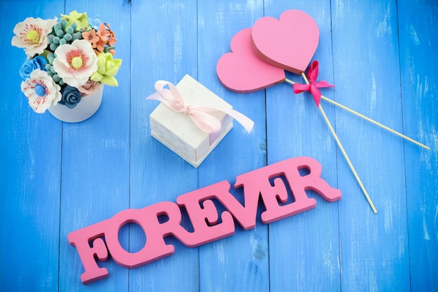 Small gift box with hearts and FOREVER text