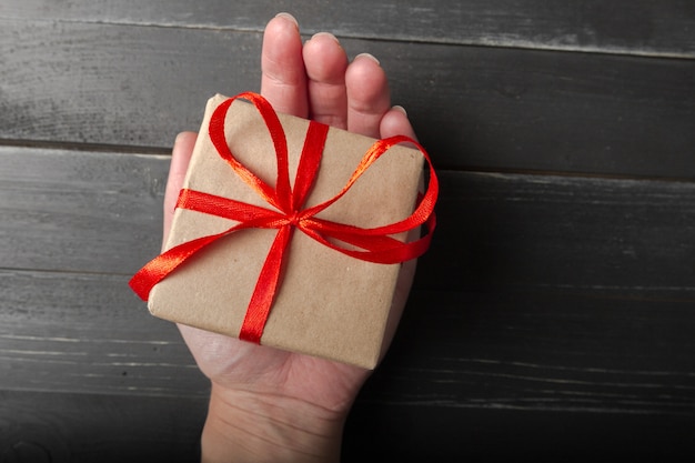 Small gift box with red ribbon close up