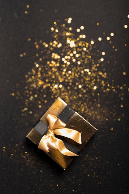 Small gift box with spangles on table