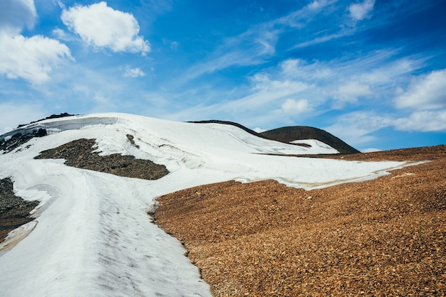 Photo small glacier on stony hill.