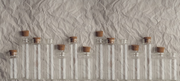 Small glass bottles with cork lid.