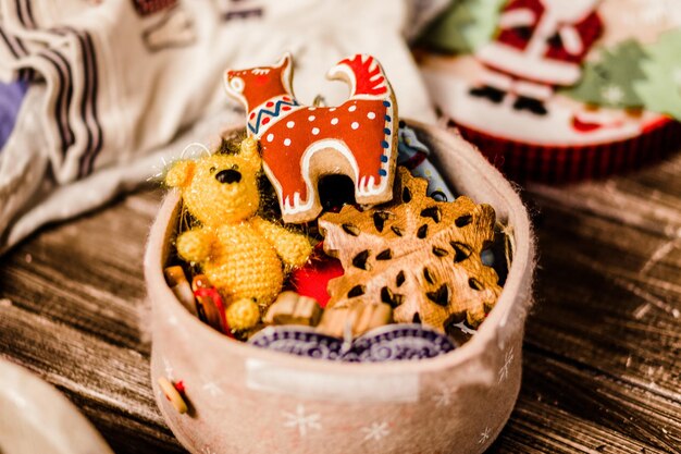 Small handmade toys lie in a box. Photo