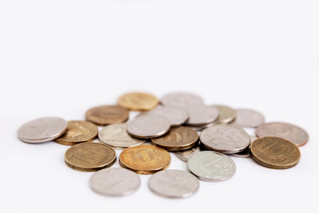 A small heap of differently colored ruble coins. Isolated