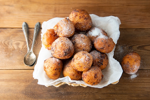 Small homemade donuts close-up on the table. Sweet dessert. cheese round donuts.