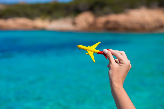 Small homemade plane on turquoise sea