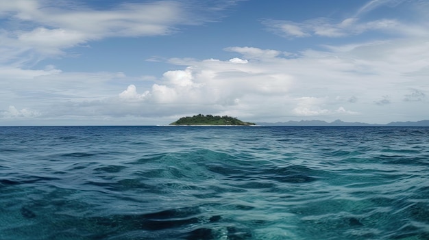 A small island in the ocean with a blue sky and clouds