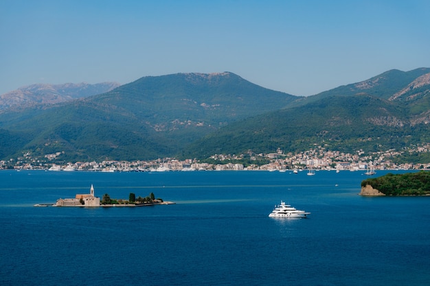 Small island of otocic gospa in the bay montenegro