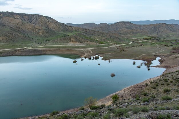 Small lake between the red mountains