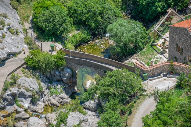 small mountain river flows through the old town.