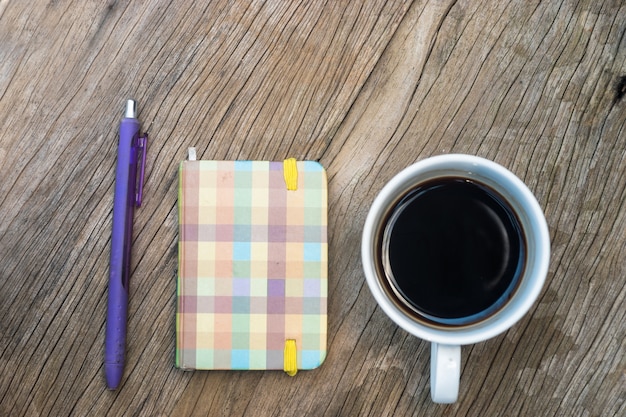 Small notebook on wood table 