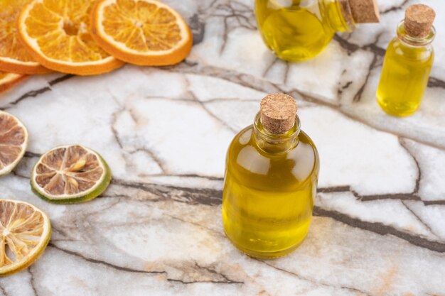 Small oil bottle isolated on white background. yellow liquid in a small glass bottle