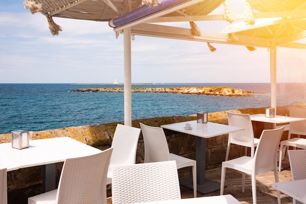 Small outdoor cafe on sea coast in Italy in summer