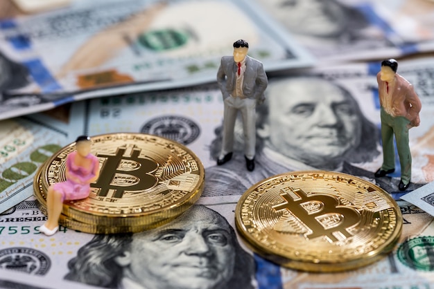 Small people on bitcoin above american dollars