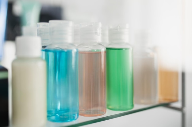 Small plastic containers with colored liquids