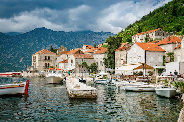 Small port with pier and boats in the historic town of Perast in Bay of Kotor