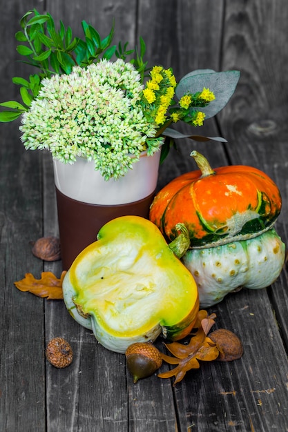 small pumpkin on wooden table, autumn