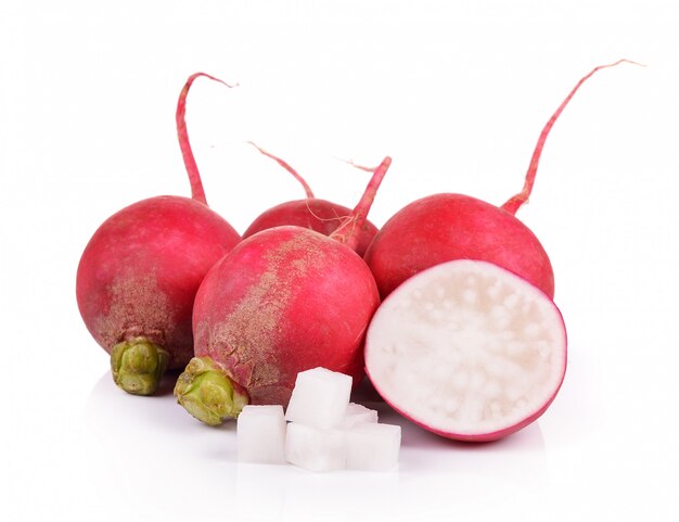 Small radish on white wall