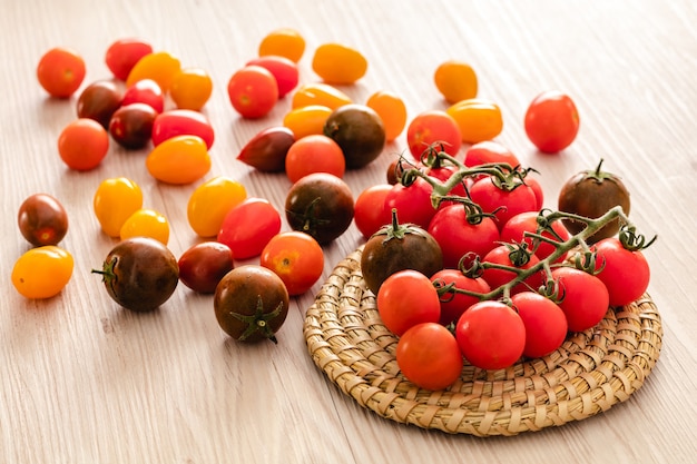 Small red cherry tomatoes on rustic wall