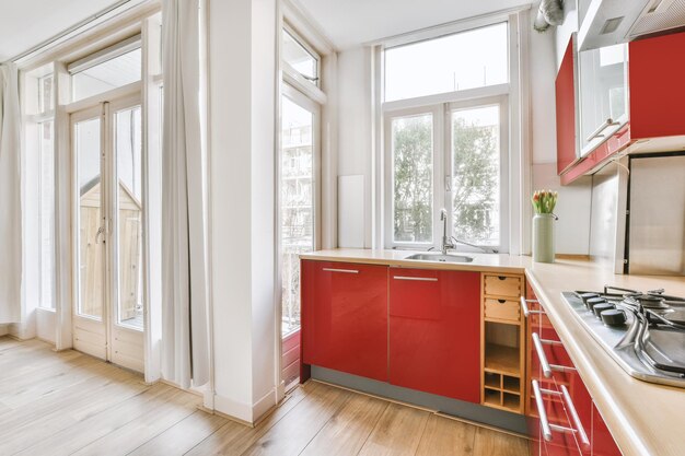 Small red corner kitchen near balcony