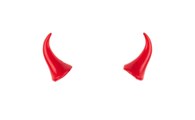 Photo small red devil horns isolated on white background