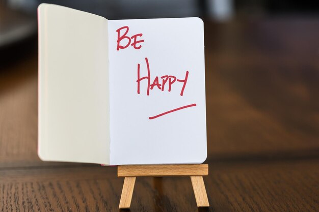 Small red notebook on easel stand