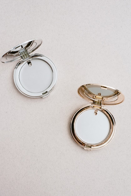 Small round cosmetic pocket mirrors in gold and silver. Pocket mirrors