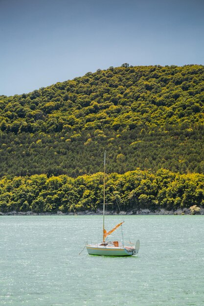 Small sail boat on lake Abrau Russia