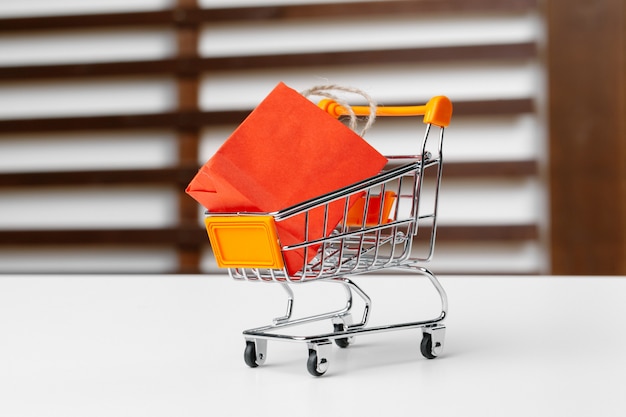 Small shopping cart with paper bags