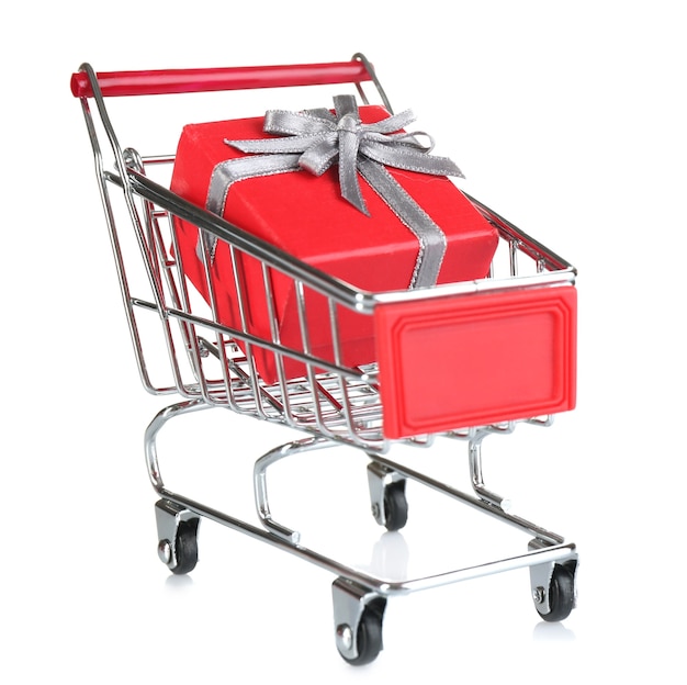 Small shopping cart with present box isolated on white