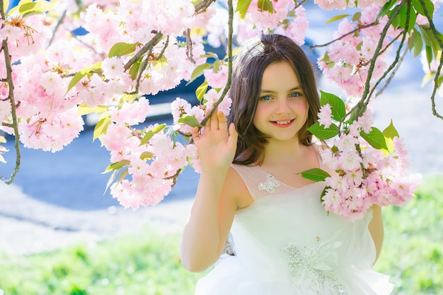 Small smiling girl in blossom