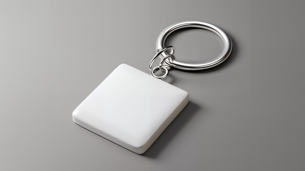 a small square shaped object with a silver handle that says the key