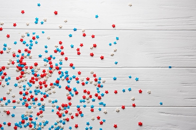 Small star candies on wooden table