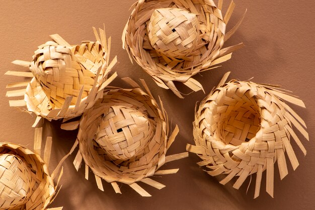 Small straw hats used for festa junina ornaments on brown