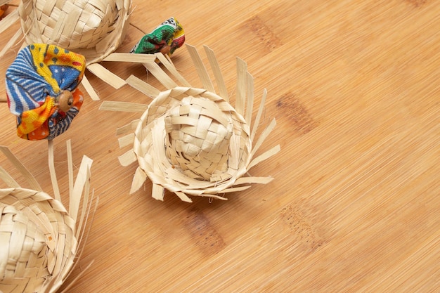 Small straw hats with Brazilian junina party decorations