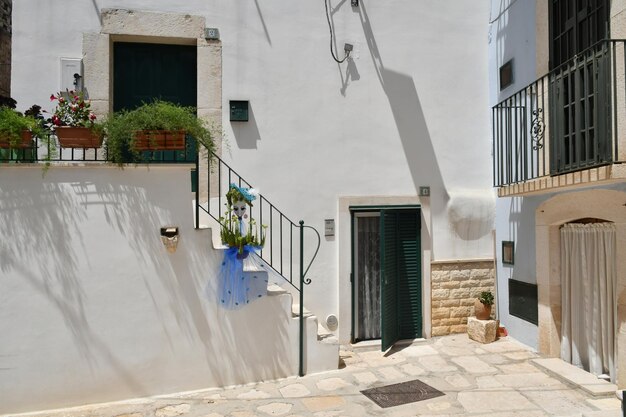 Photo a small street in casamassima a village with bluecolored houses in the puglia italy