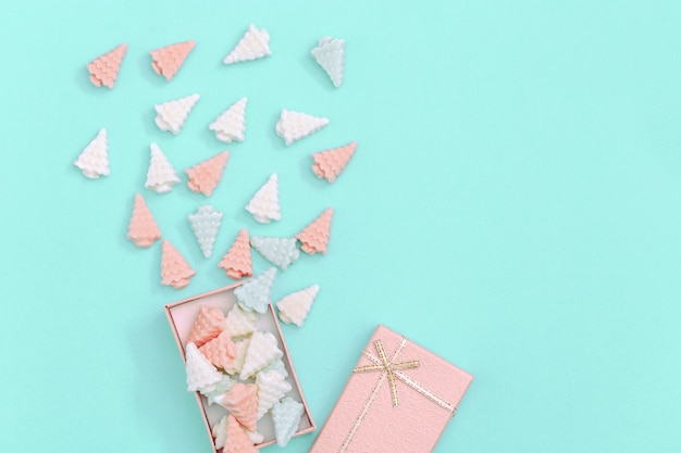 Small sweet chocolate candies in shape of Christmas trees